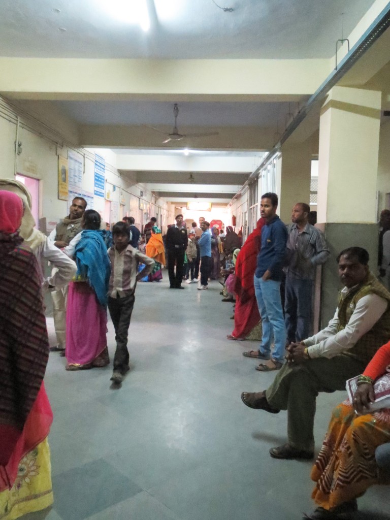 Patients and families waiting in hospital corridor