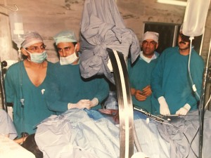 Dr. Mantu Gupta performing percutaneous nephrolitomy (PCNL) procedure while local urologists watch and learn.