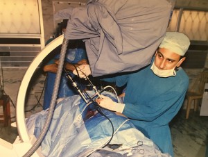Dr. Gupta adjusts his equipment and instruments
