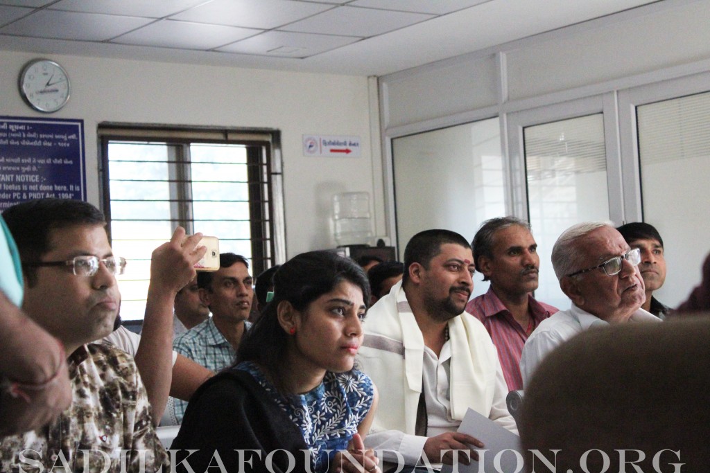 Local townspeople and volunteers listen intently as Dr. Mantu Gupta delivers a heartfelt speech about SadilKa's mission in honor of his son, Dilan Gupta.