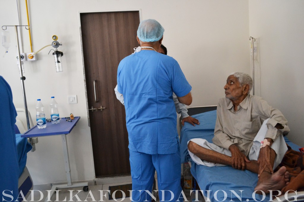 Dr. Patel checking on his patient in the recovery room.