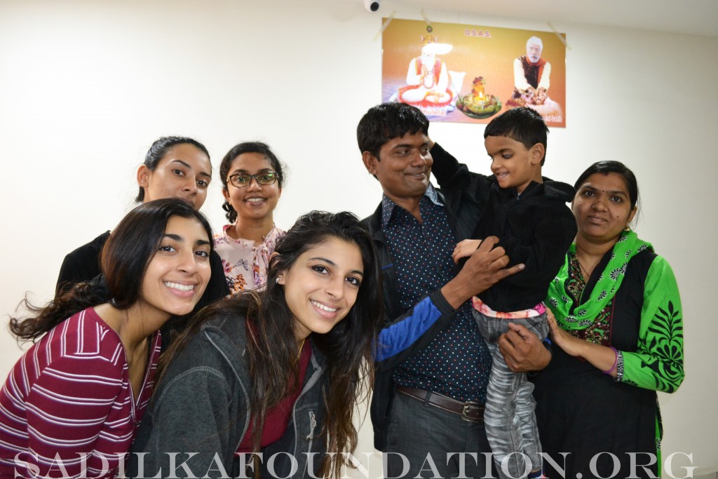 Child's parents with Kasmira and Sarina (front) and Monika and Pooja (back)