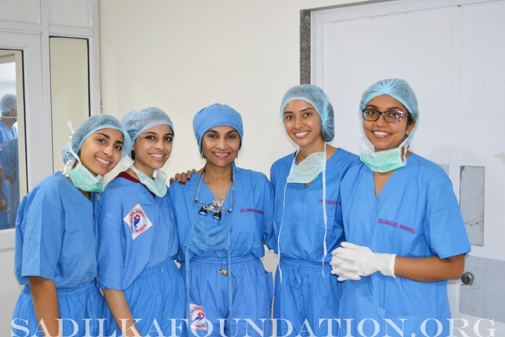 Dr. L. Gupta flanked by daughters Kasmira and Sarina on the left and Monika and Pooja on the right