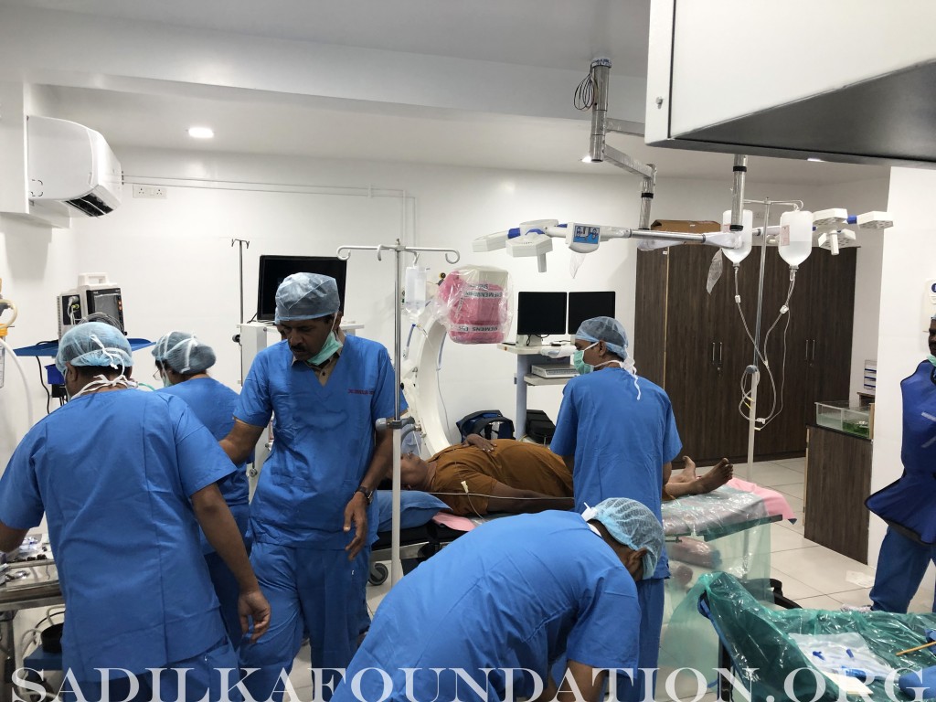 OR Volunteers prepare Dr. Gupta's patient for surgery.