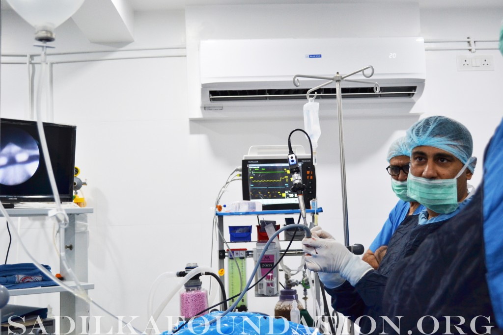 Dr. Gupta performs a percutaneous nephrolithotomy (PCNL) for stone removal while a local doctor observes. 