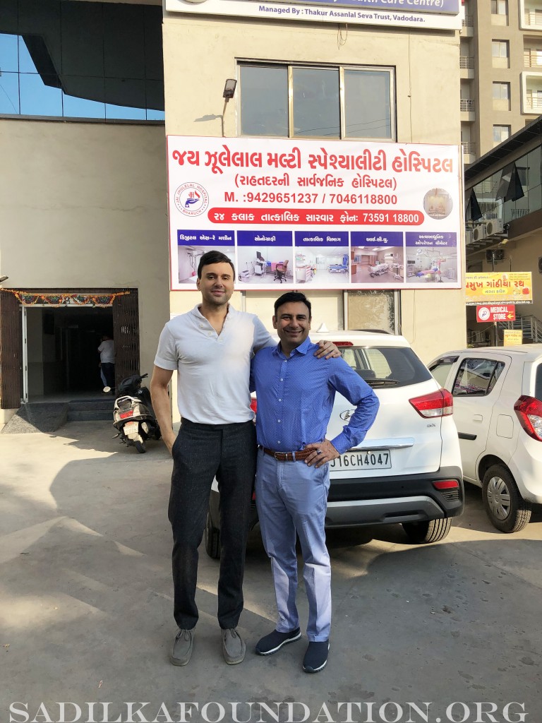 Dr. Chandhoke and Dr. Gupta outside the hospital before heading to the OR